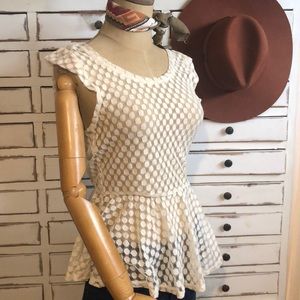 Lace peplum short cap sleeved top.